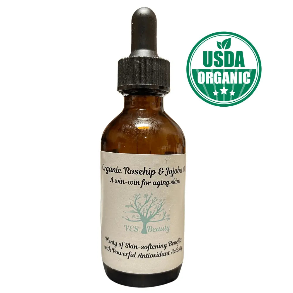 Organic Rosehip & Jojoba Oil dropper bottle for anti-aging benefits, labeled USDA Organic, perfect for youthful skin care.