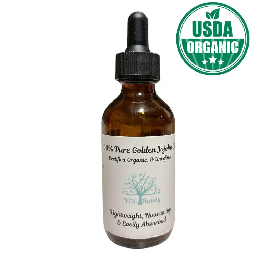 100% Pure Golden Jojoba Oil in a glass dropper bottle, certified organic, lightweight, nourishing for skin and hair.